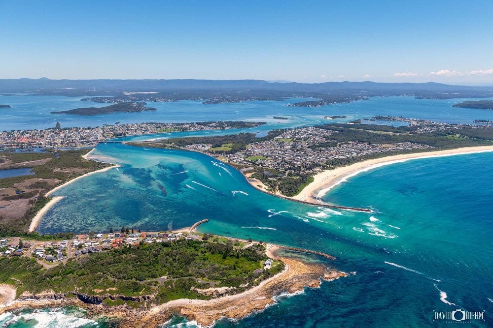 Aerial view of Blacksmiths Beach, Swansea Channel and Lake Macquarie on the NSW coast.