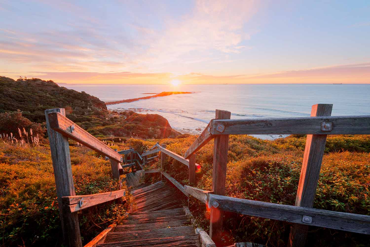 spoon-rocks-lookout-boardwalk-sunrise-lake-macquarie.jpg Boardwalk leading to Spoon Rocks Lookout overlooking Spoon Rocks Bay at sunrise in Lake Macquarie NSW.