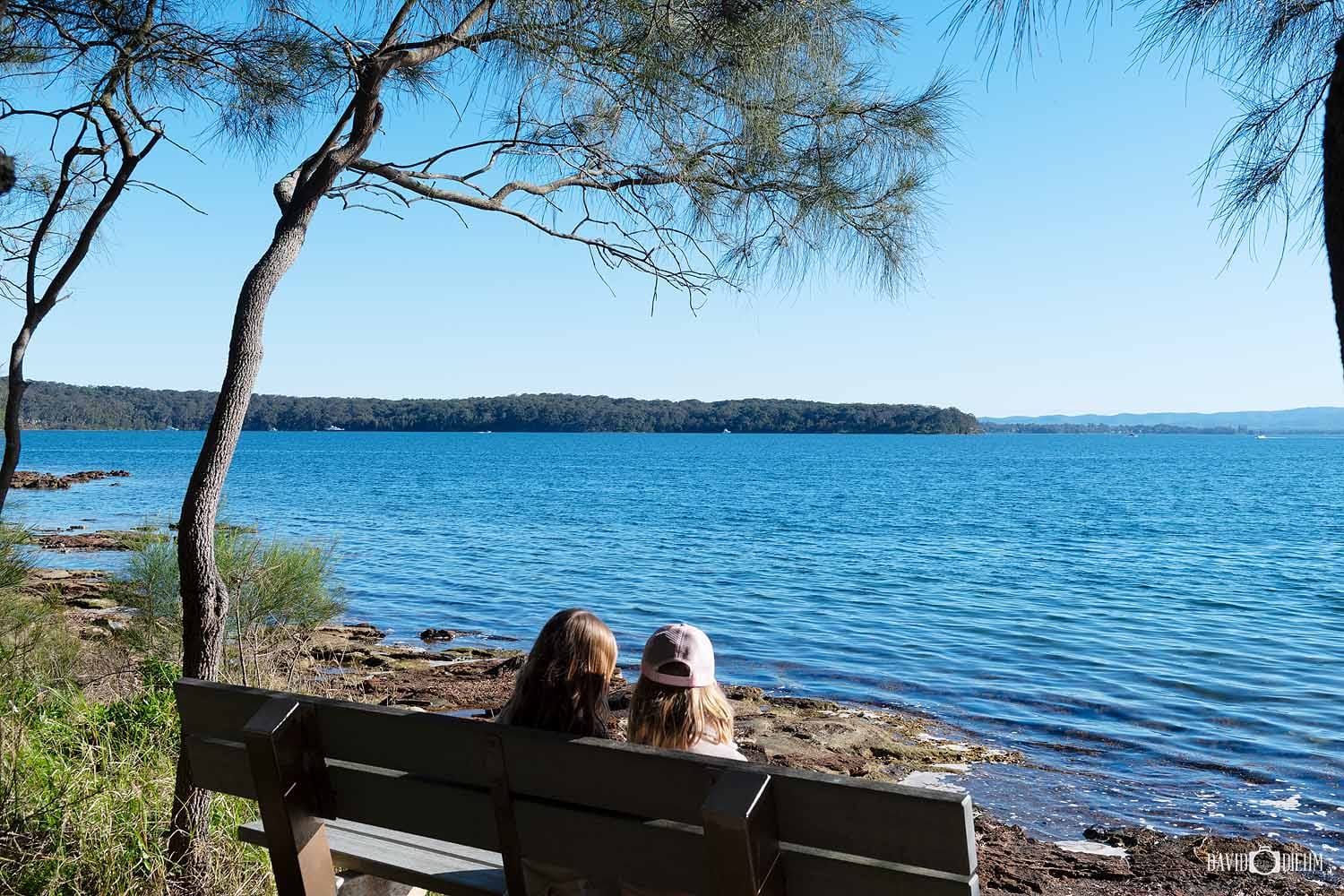 wangi-point-lookout-bench-lake-macquarie.jpg Visitors enjoying the lake views from the seating area at Wangi Point Lookout overlooking Pulbah Island.