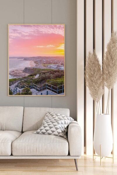 Framed wall art featuring a sunrise over ANZAC Memorial Walk displayed in a modern living room.
