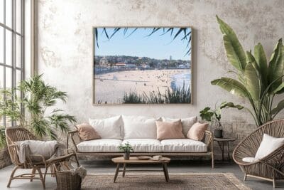 Framed Bondi Beach coastal photography displayed as wall art in a bright modern living room.