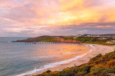Sunrise over Catherine Hill Bay Beach and the historic Catherine Hill Bay Jetty in Lake Macquarie NSW.