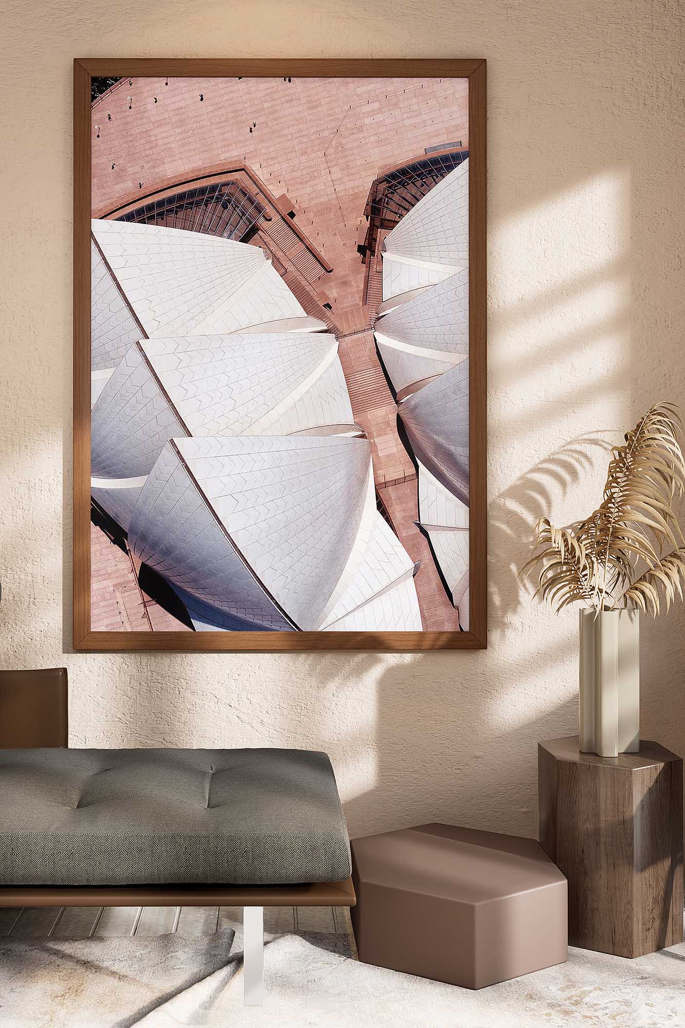 Aerial photography of the Sydney Opera House sails and forecourt, displayed as framed Sydney wall art in a modern interior.