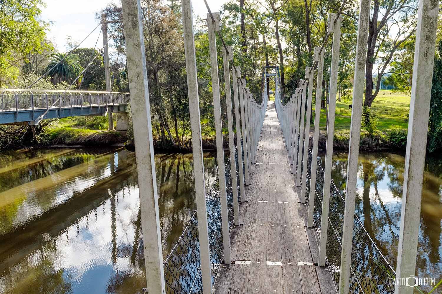 View along the Cooranbong Swing Bridge over Dora Creek, NSW.
