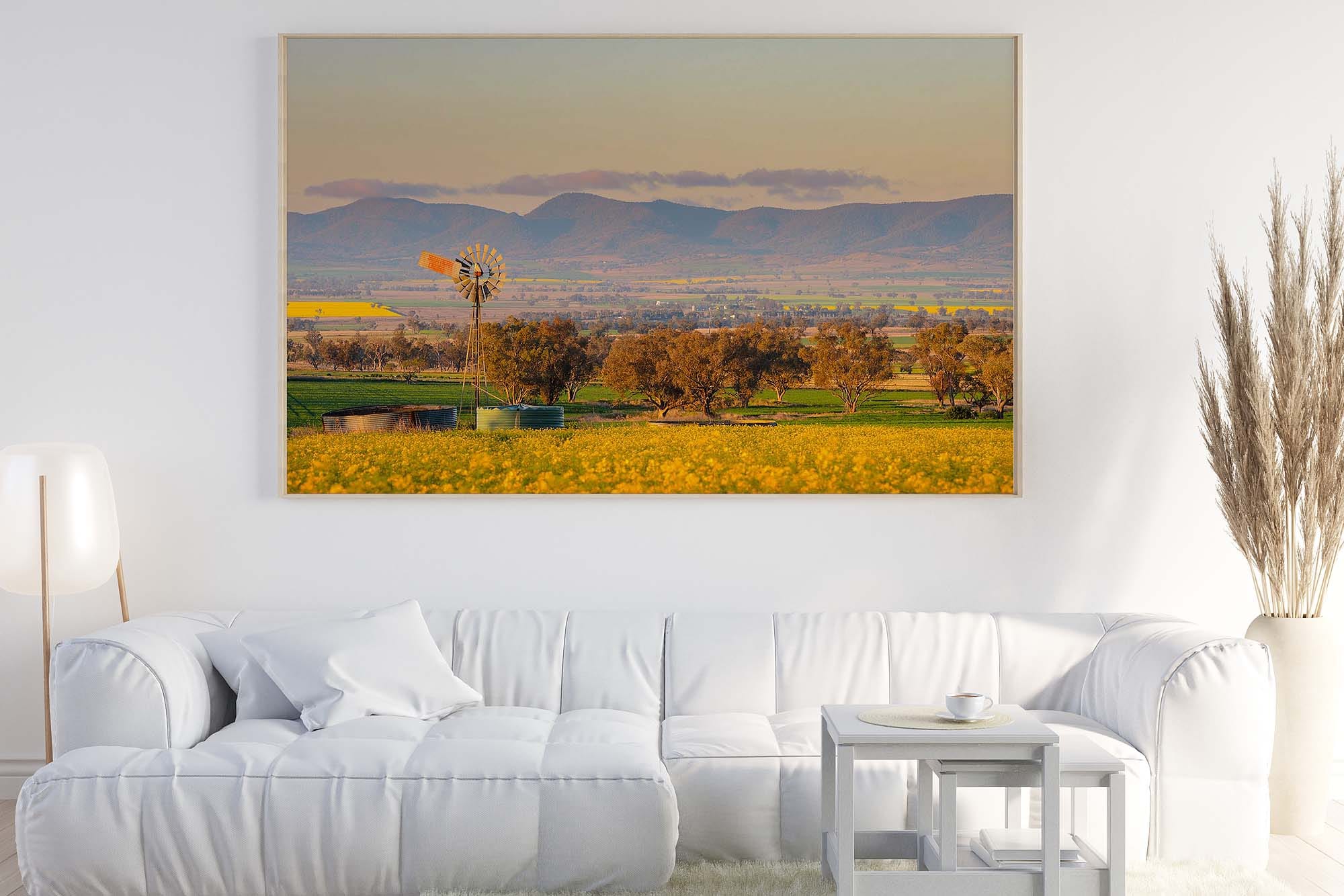 Large Australian landscape wall art print displayed above a white sofa in a modern living room