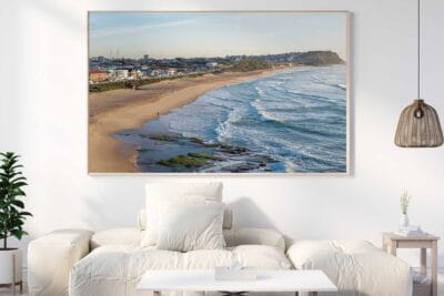 Merewether Beach Coastline Newcastle photographic print displayed as large framed coastal wall art in a modern living room.